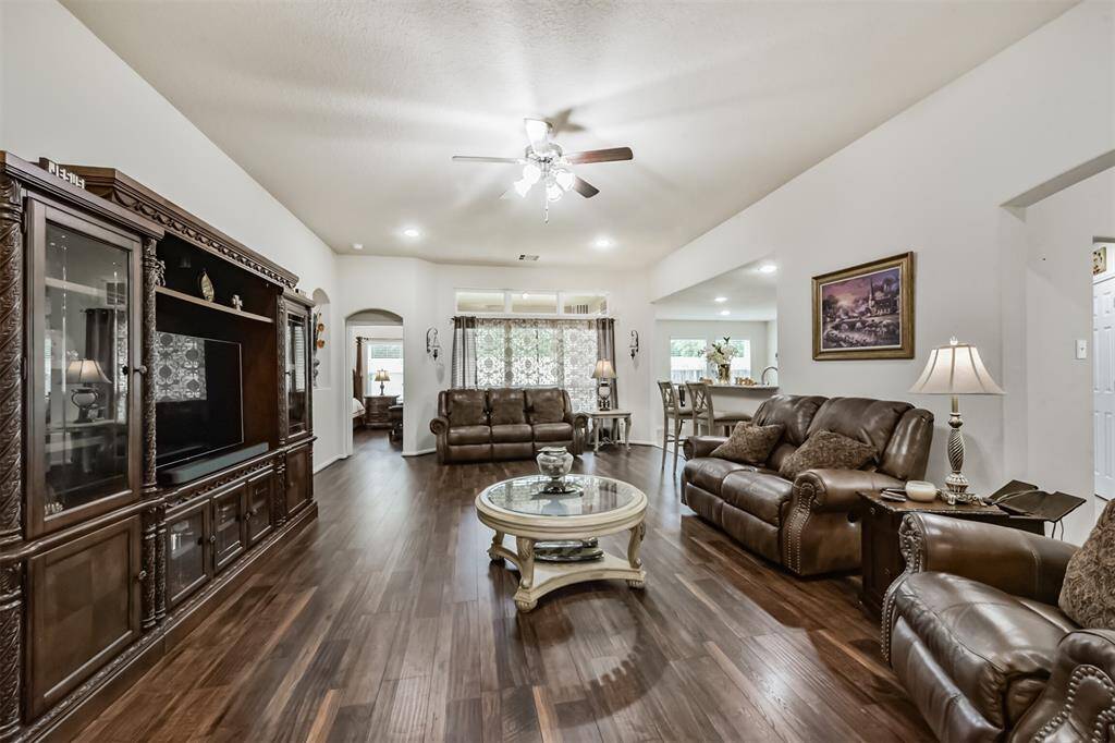 The living room is very spacious for a variety of furniture and arrangements. Ceilings are 10ft high.