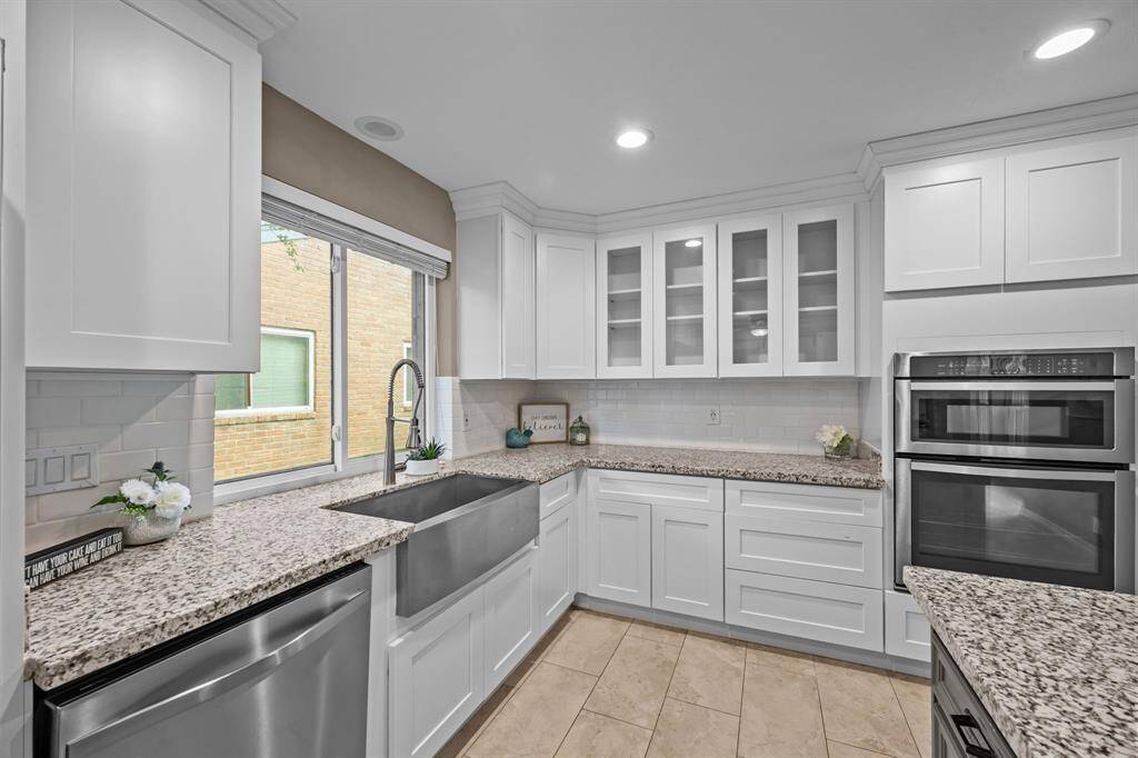 This kitchen is a culinary dream, offering ample storage and a stylish design.