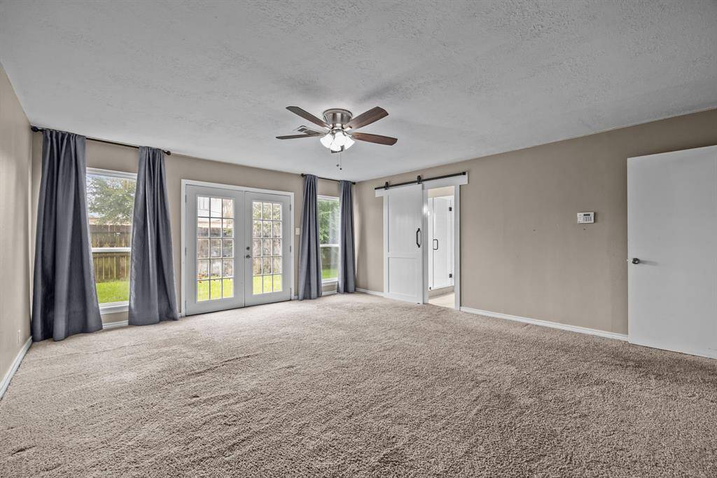 This spacious primary suite accommodates all your furniture needs effortlessly.