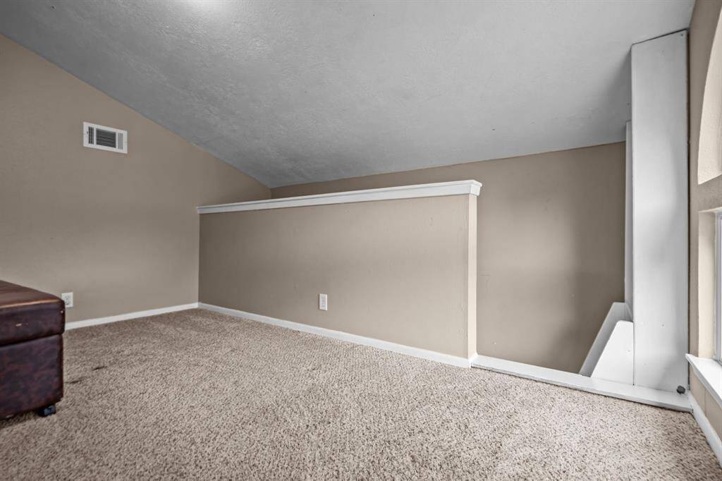 This versatile loft space from the fourth bedroom offers endless possibilities for your family's needs.