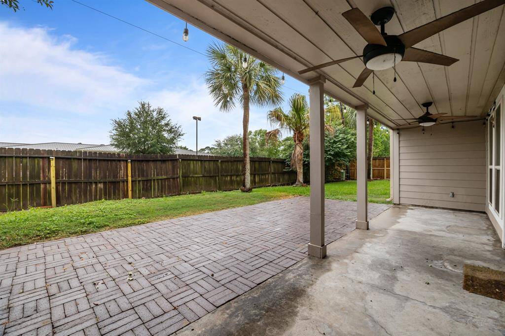 Relax on the covered patio, complete with a cooling fan for comfort on hot summer days.