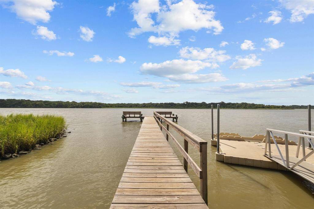 Enjoy serene waterfront living with access to a private neighborhood fishing pier.