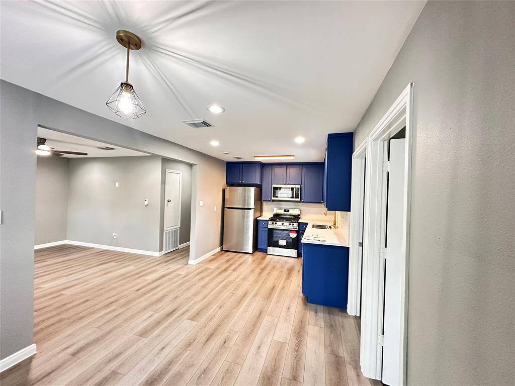 Dining area with kitchen and living area.