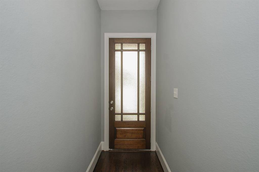 Photos from previous listing. Gorgeous entry into the home with stunning glass front door.