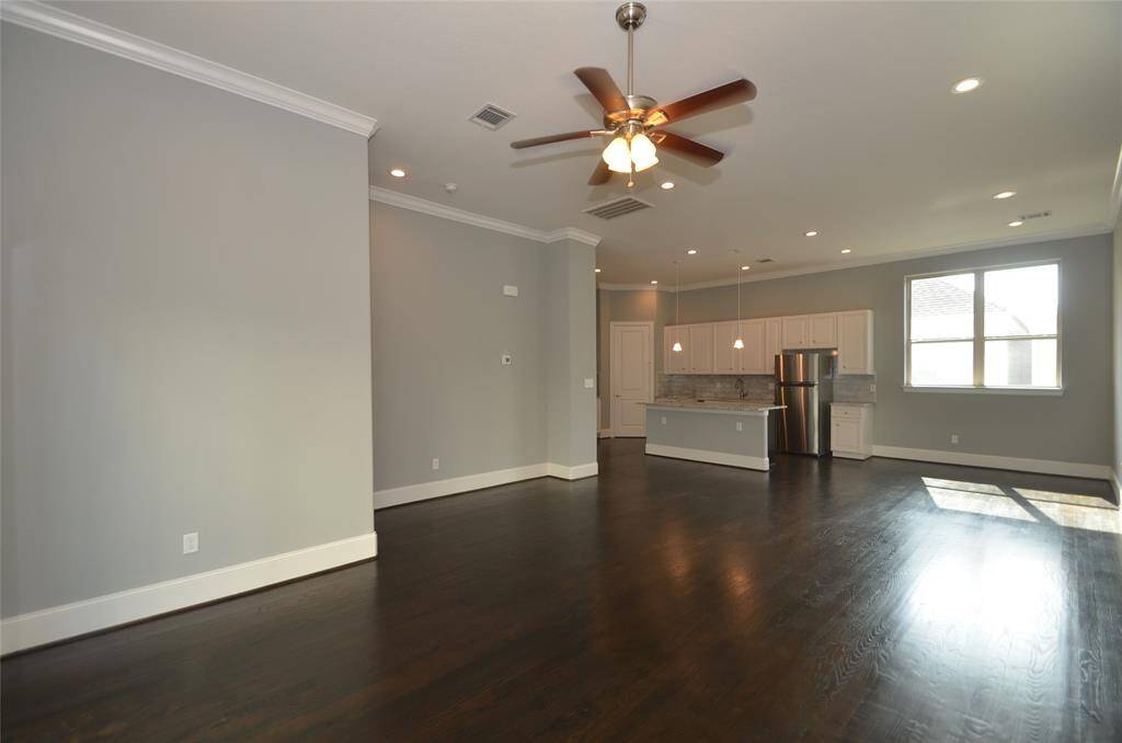 Photos from previous listing.View of kitchen from living area.  Note the high ceilings and size of room.