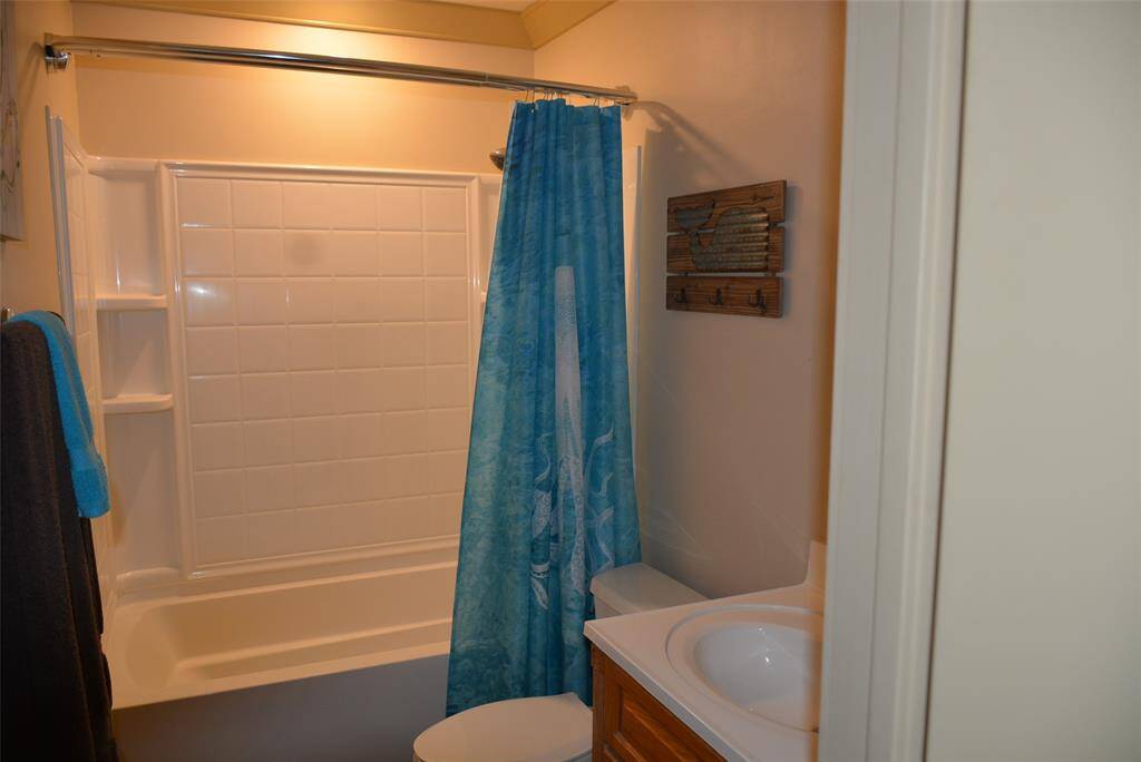 Step into a versatile space featuring a formal dining area, currently showcasing a pool table, with a sleek modern kitchen just steps away. Enjoy the convenience of a stylish wet bar and easy access through the nearby main entrance.
