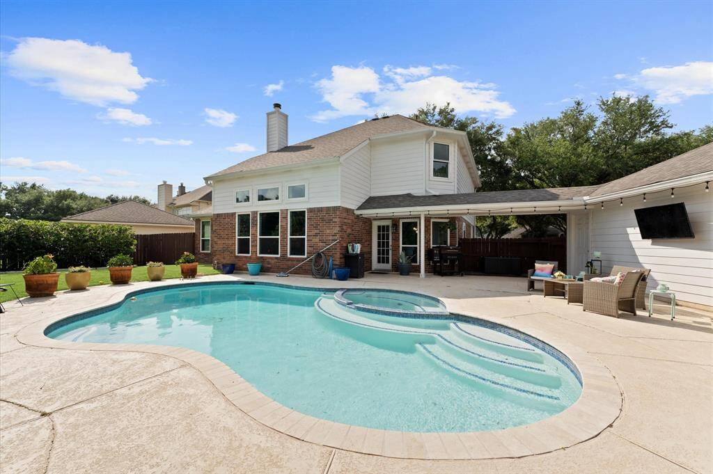 Enjoy your evenings in this gorgeous backyard with a heated pool that you can use all year long! TV included!
