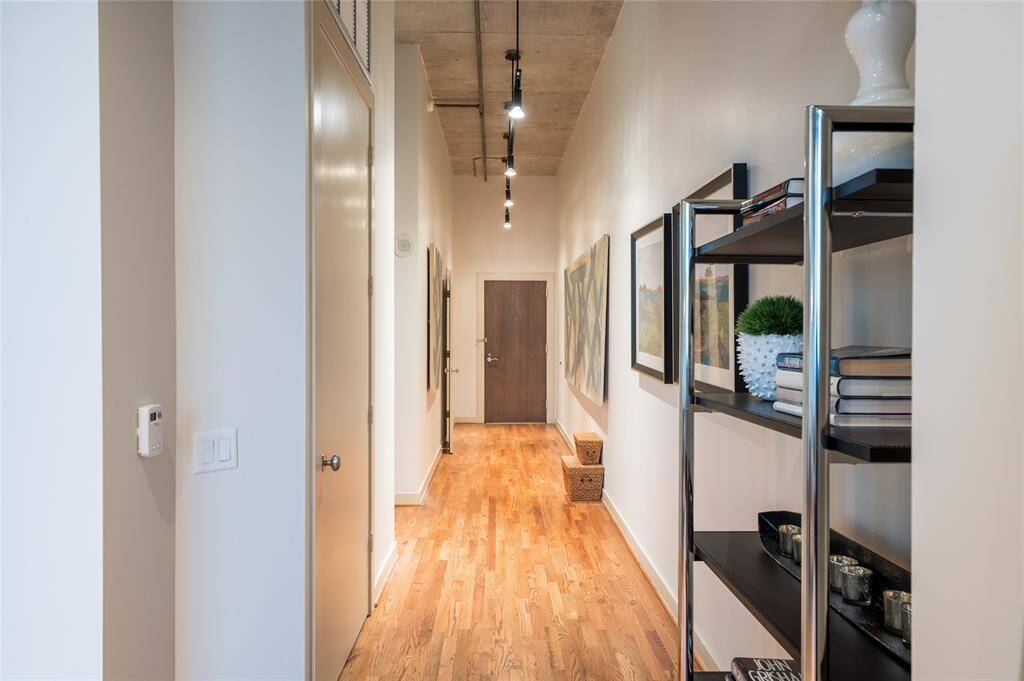 Impressive gallery wall as an entryway in this gorgeous unit.