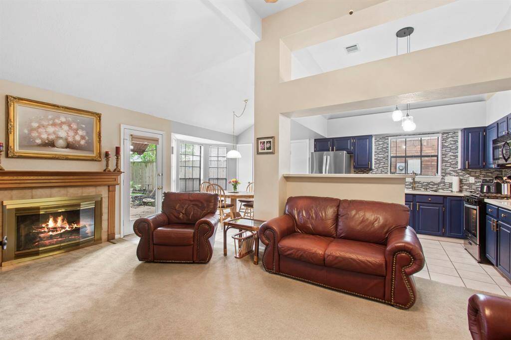 Modern kitchen seamlessly connects to the inviting living room.