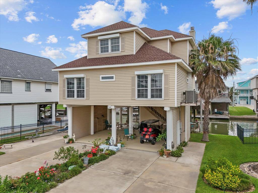 The custom built home features automatic roll down hurricane shutters, ensuring both natural light and protection.
