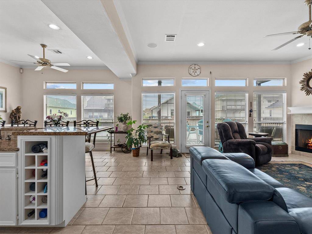 This expansive open-concept living area seamlessly connects the kitchen, dining, and living spaces, ideal for entertaining.