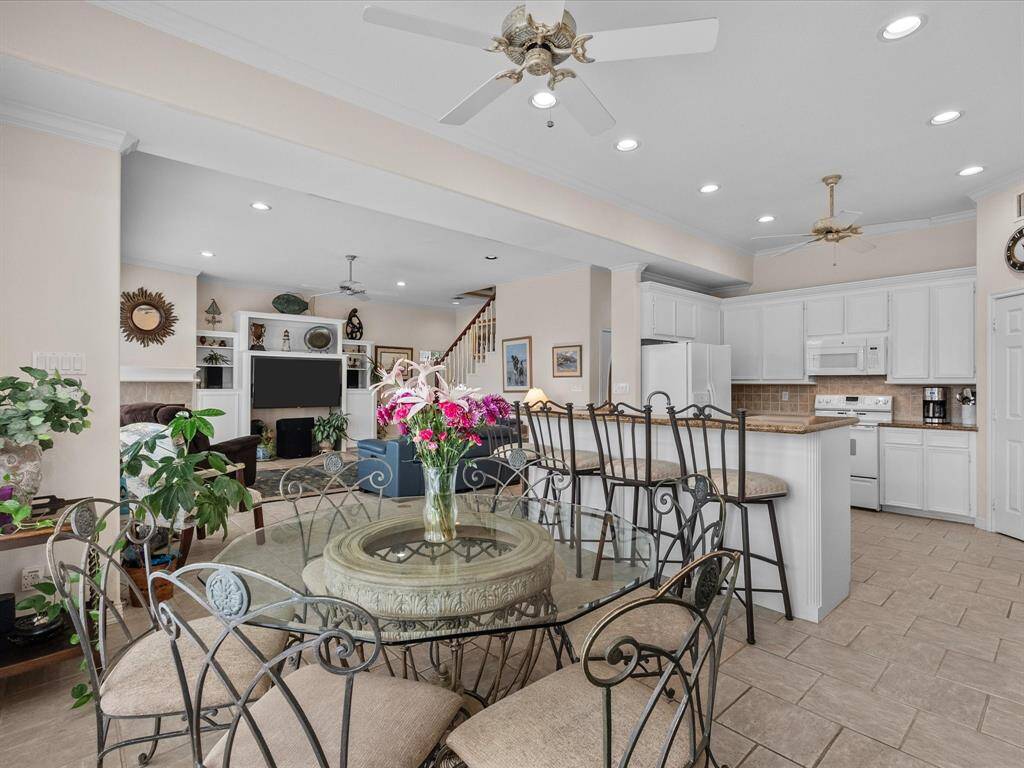 This bright and airy dining area is an inviting space for meals and gatherings.