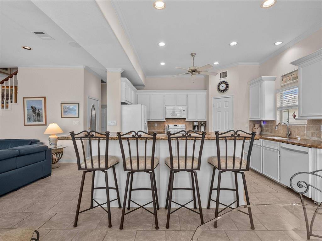 The large island has seating for four, perfect for casual entertaining.