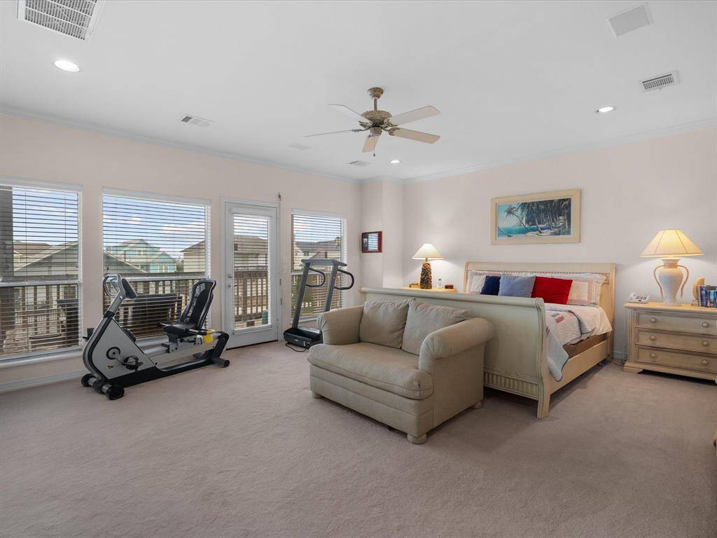 This HUGE primary suite offers ample natural light through large windows and direct access to a private balcony, perfect for enjoying the views.