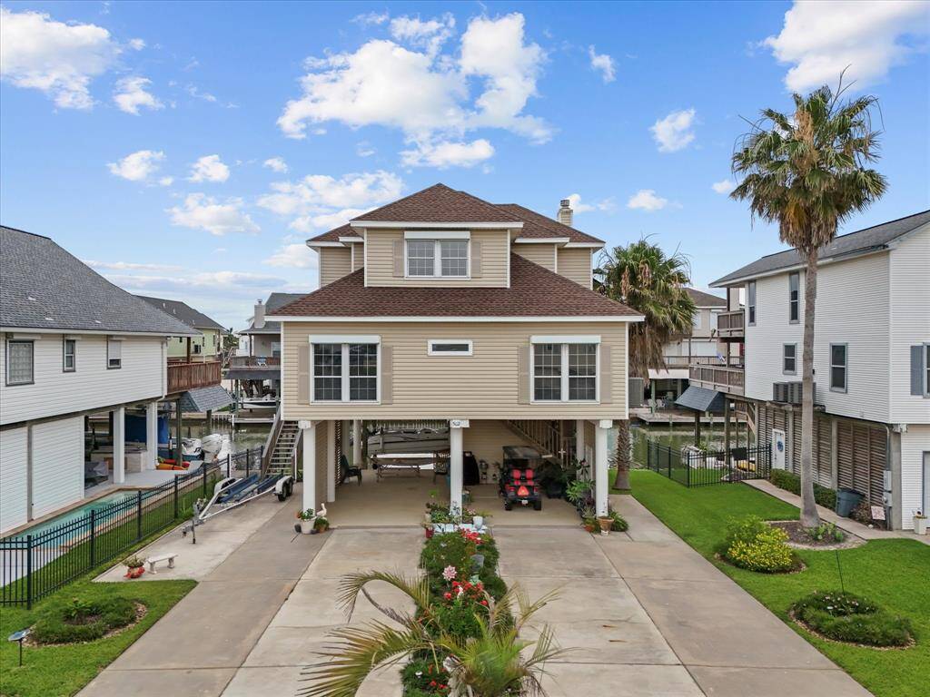 502 Westerly Drive is a distinctive multi-story design with generous under-house space for parking and storage