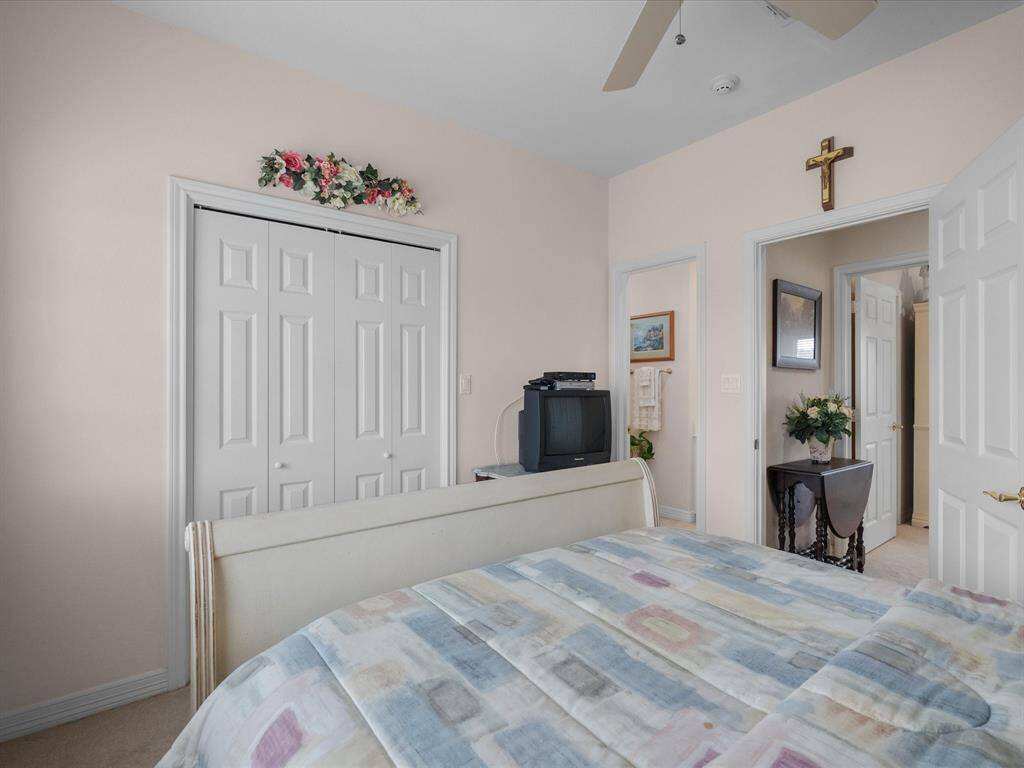 Bedroom 2 upstairs offers generous storage space in built-in closet.