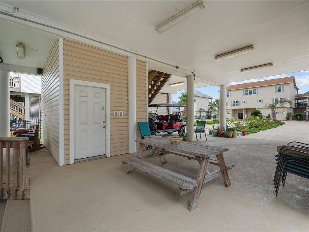 The expansive covered ground-level area provides a versatile space for outdoor living and recreation. Plus downstairs storage room for fridge and fishing gear!