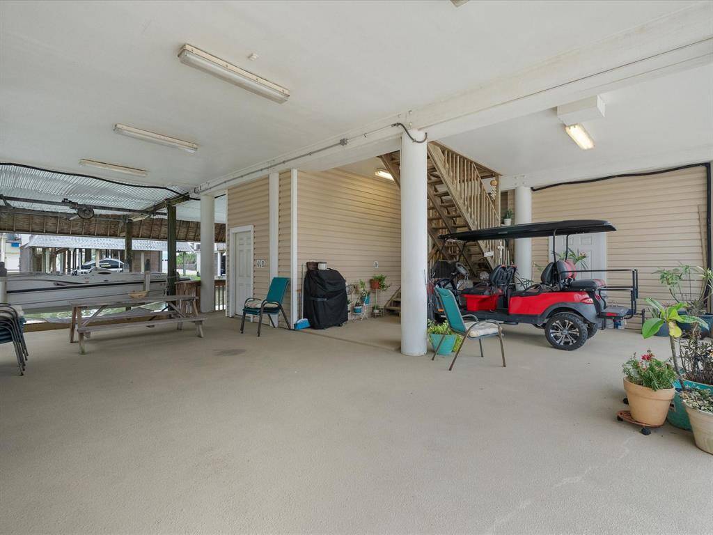 This area has ample room for parking, for cars and/or golf carts. Plus slip resistant coated concrete!