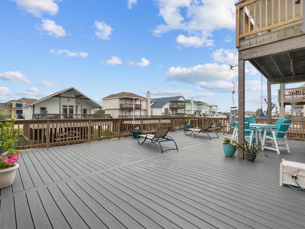 The elevated main deck is both expansive and functional. Recent TREX decking and ample room for furniture and activities, while also offering a great view from above.