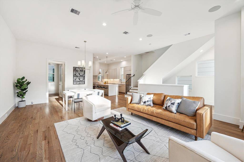 You’ll find a sleek and transitional design with exceptional premium finishes including an abundance of natural light, nearly floor to ceiling windows, stunning gleaming red oak hardwood floors.