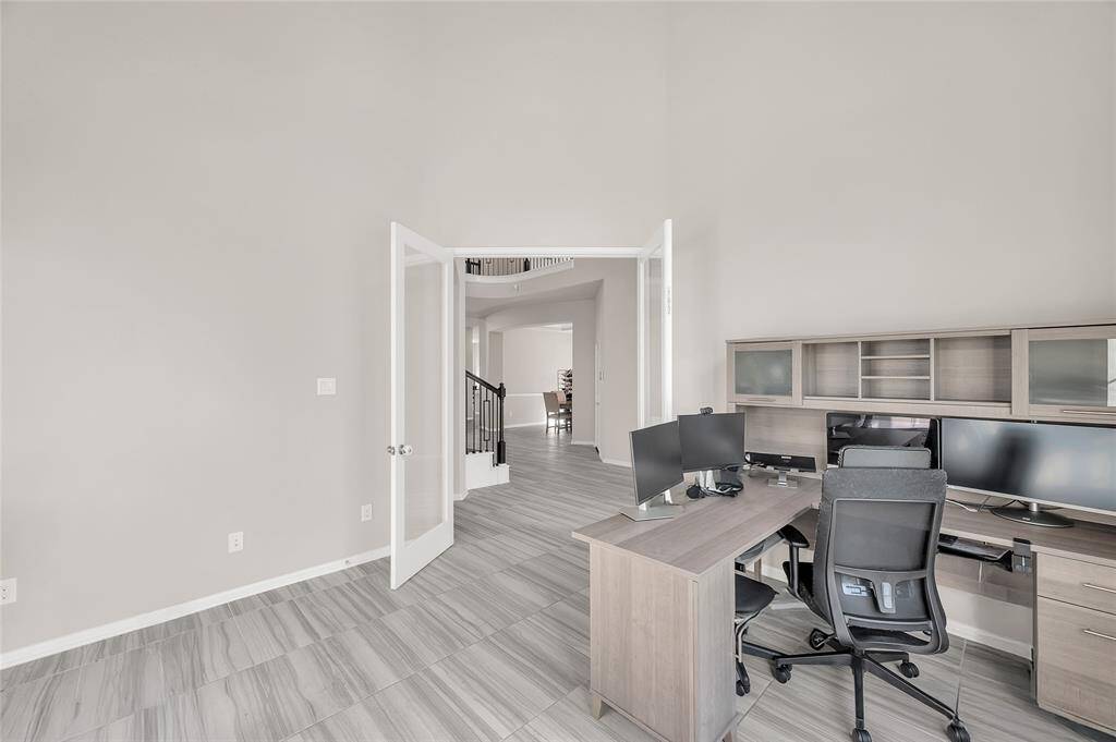 The private home office offers versatile use, easily transforming into a workout room or nursery