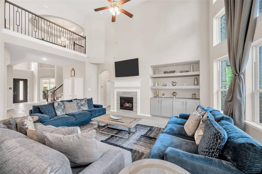 The primary bedroom is discreetly nestled behind the living room, tucked away in the corner of the home
