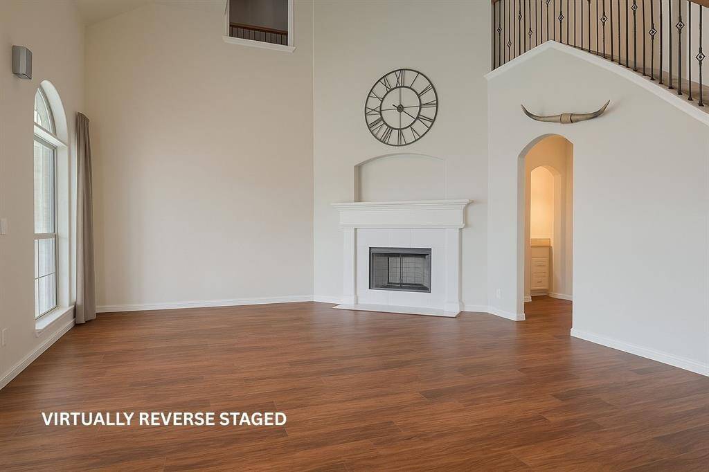 Family room with windows looking onto backyard