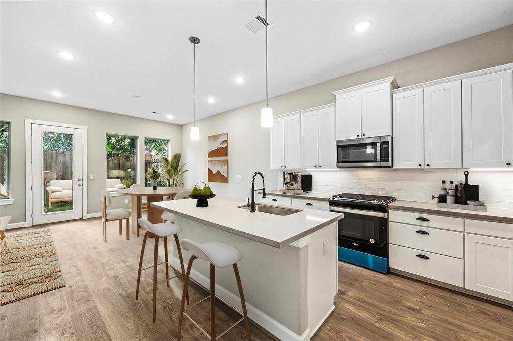 From the airy living room to the bright dining nook and sleek island kitchen, every detail balances comfort and style.
