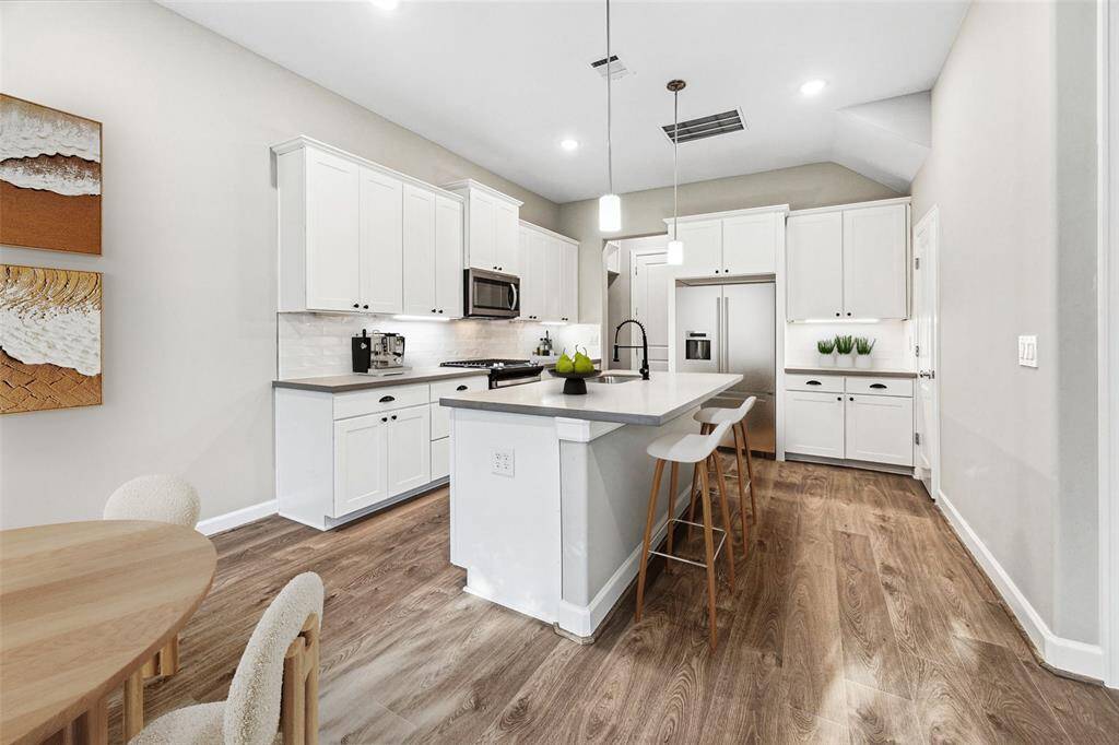 From cooktop to cleanup, this kitchen layout is as efficient as it is stylish—with plenty of prep space and pantry storage.