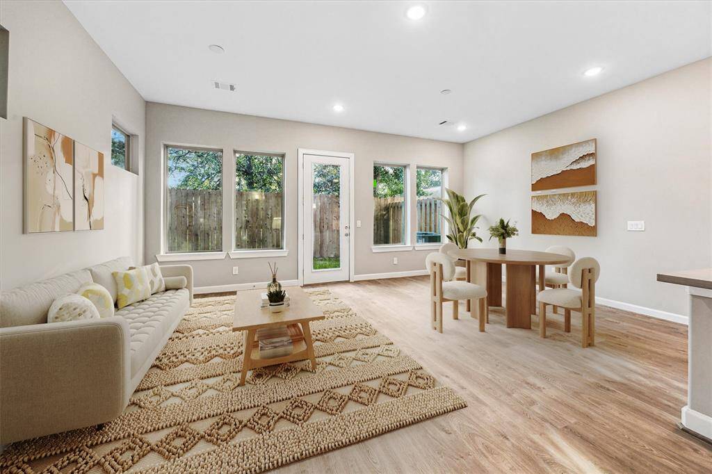 Oversized windows and wide-plank floors set the tone for elevated living, ready to reflect your personal style.