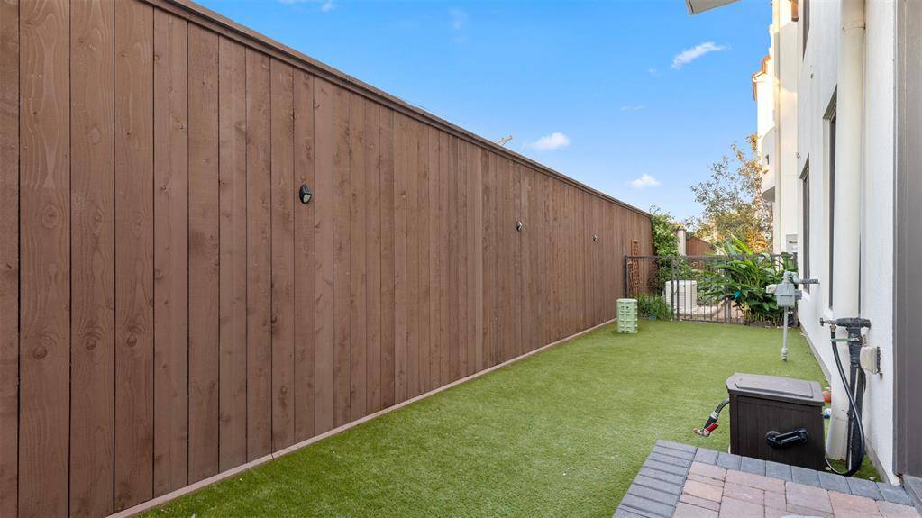Back yard with astro turf.