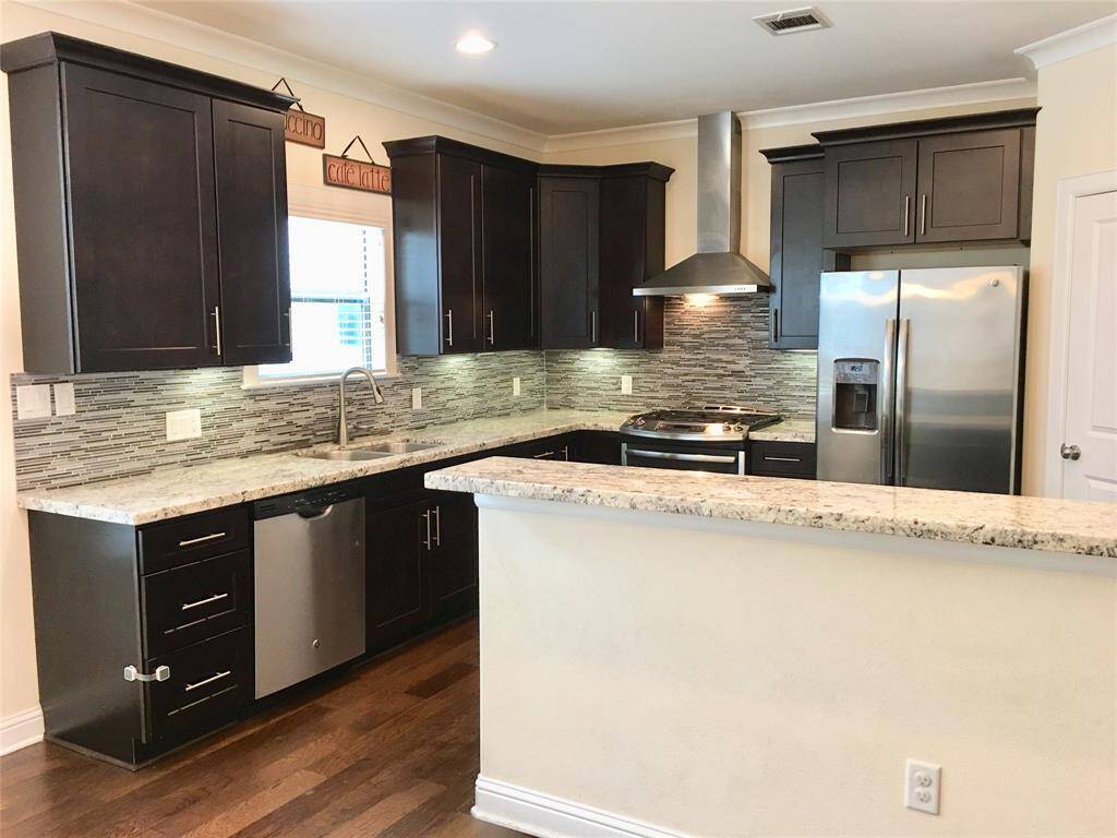 Kitchen with stainless steel appliances.