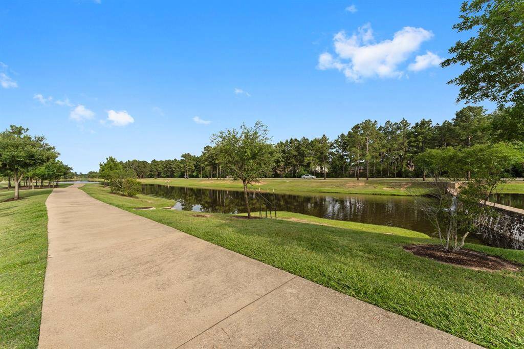Enjoy peaceful walks along this scenic trail that borders a tranquil pond and lush green space.