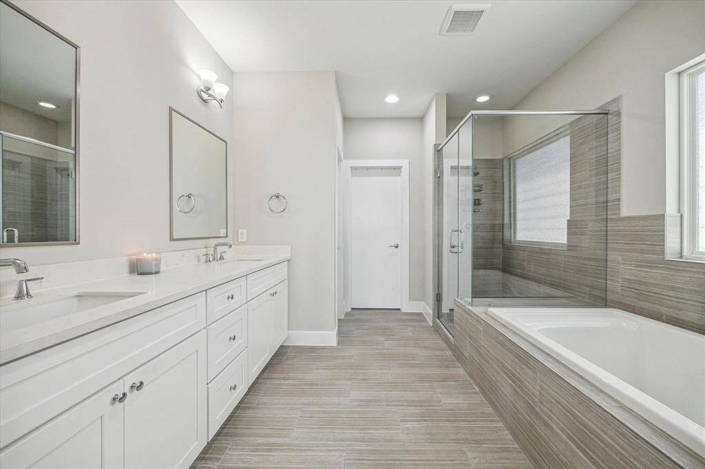 Primary has a spa en-suite bathroom featuring dual vanities, large soaking tub and a spacious walk-in shower.