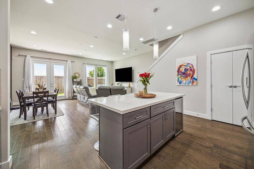 Be ready for entertaining with the kitchen island seating, dining area and living room layout.