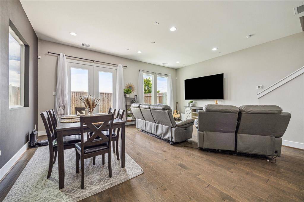 The open layout on the first floor features a spacious living and dining area.