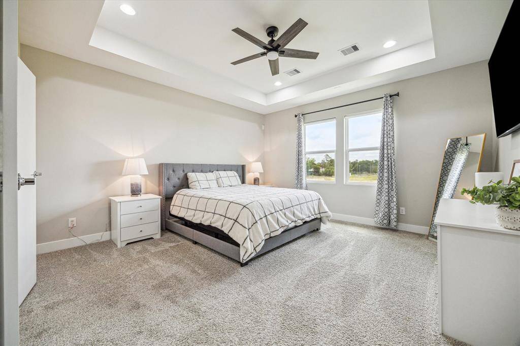 Oversized primary suite is large enough for an additional seating area, reading nook or office.