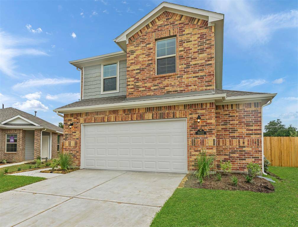 Beautiful Brick and Stucco Front Elevation, extended driveway for additional parking, and Luscious Landscaping offered upon arrival to this Exquisite home!
