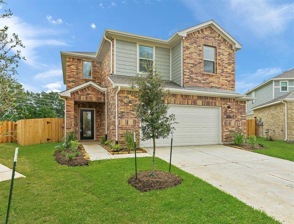 An additional view of the Beautiful Front Elevation, Luscious Landscaping, and abundance of green space to make your own!