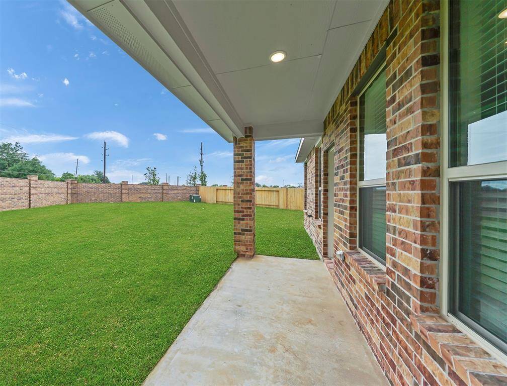 Charming Covered Patio out back to enjoy the serene view, and extended patio great for additional entertainment space!