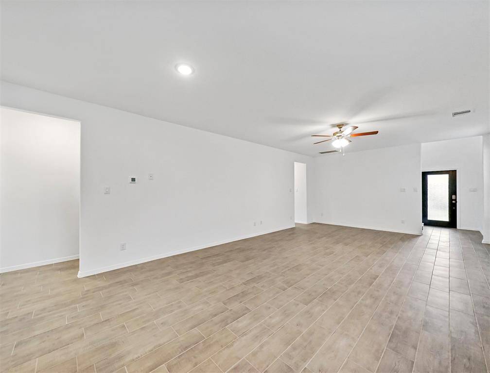 Another look into the Luxurious Living Room showcasing the elegant entryway and easy access to the secondary bedrooms