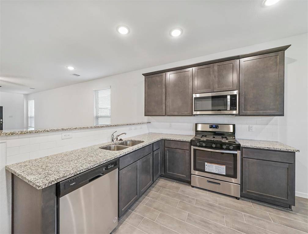 Gourmet Kitchen offers a boats Granite Countertops and Stainless Steel Appliances adding to the elegance and ambiance of this exquisite space.