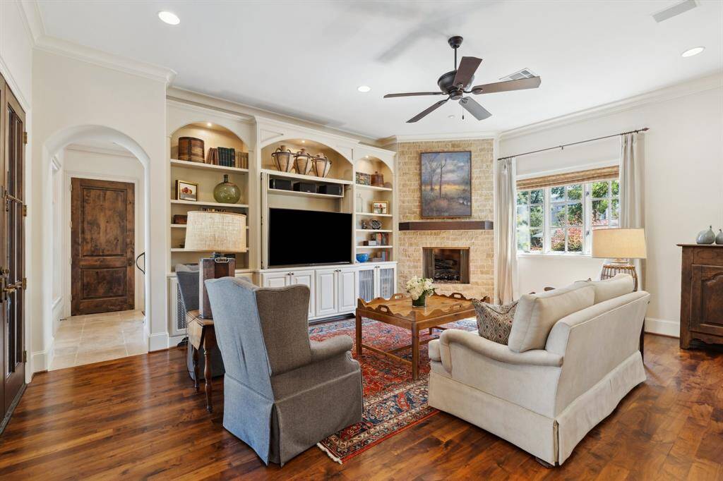 The spacious family room is open to the kitchen and breakfast room. The living room features built ins and a fireplace.