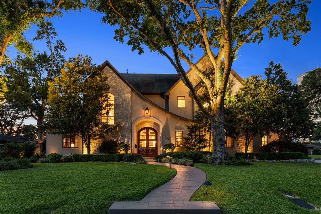 The house looks absolutely breathtaking at night, with the soft glow of landscape lighting casting a magical ambiance.
