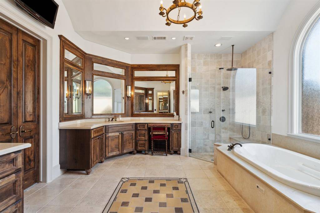 Primary bathroom with Jerusalem limestone flooring.