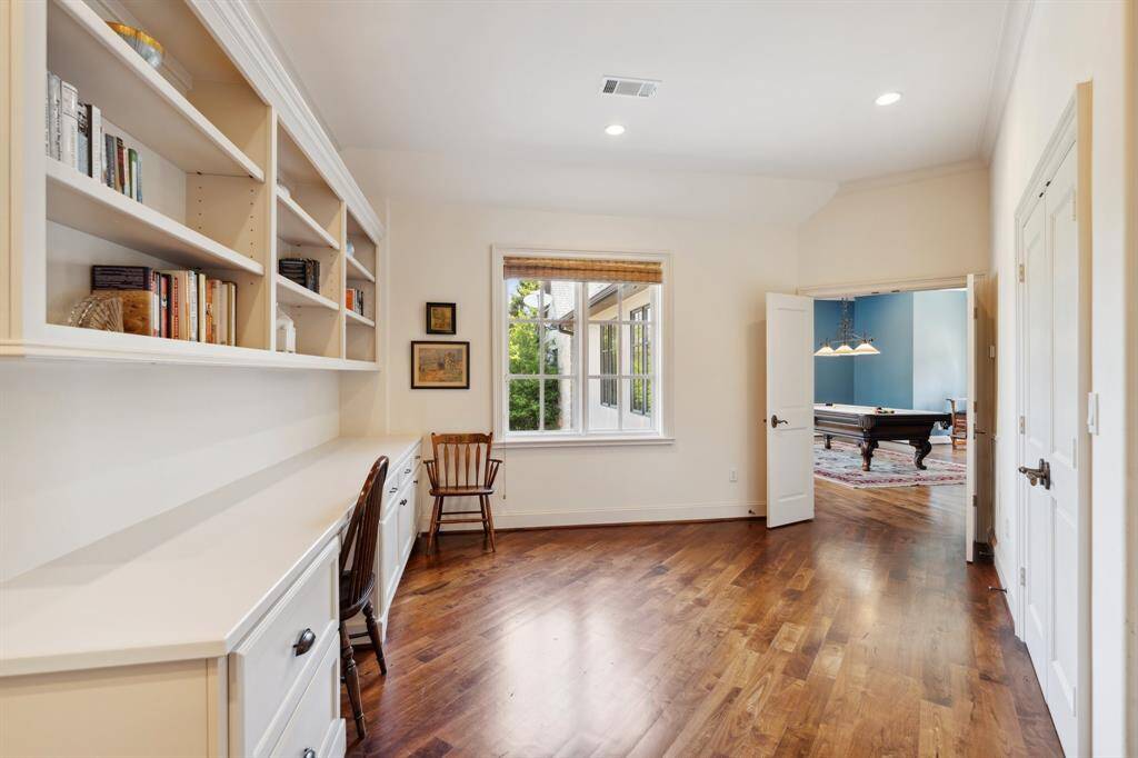The upstairs office space overlooks the backyard. This is the third office space located in the home.