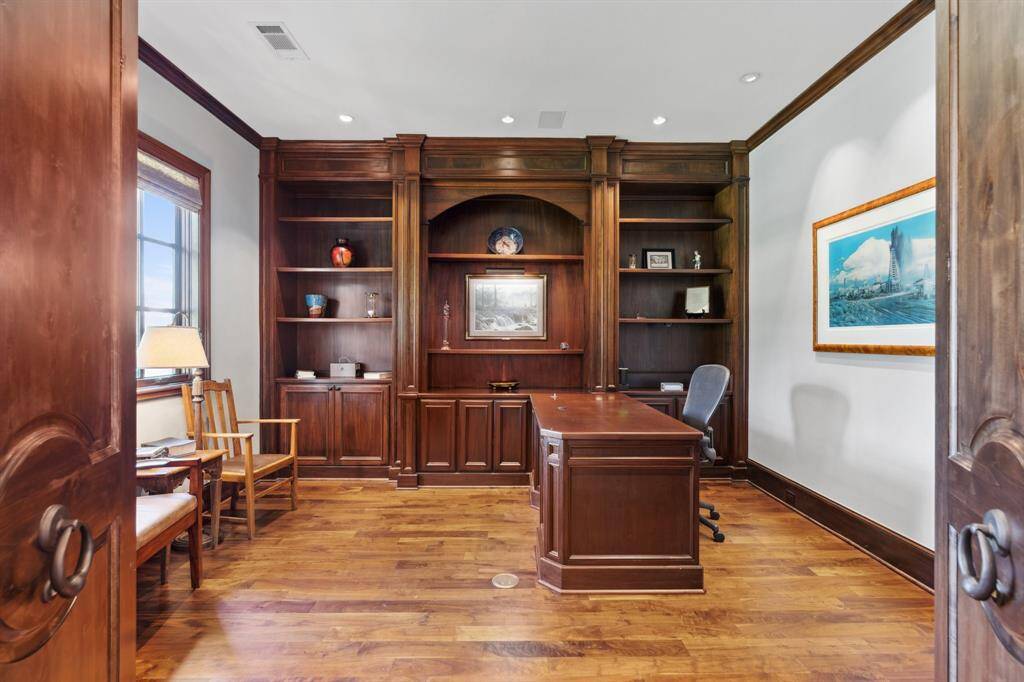 The Study features Built-in mahogany shelving and desk, Built-in speakers, recessed lighting, and Roman shades. A bonus is the Large hidden corner closet.