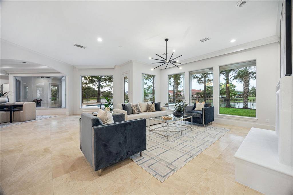 As you move back through the family room, the open layout leads effortlessly to the opposite wing of the home, connecting key living spaces with ease.