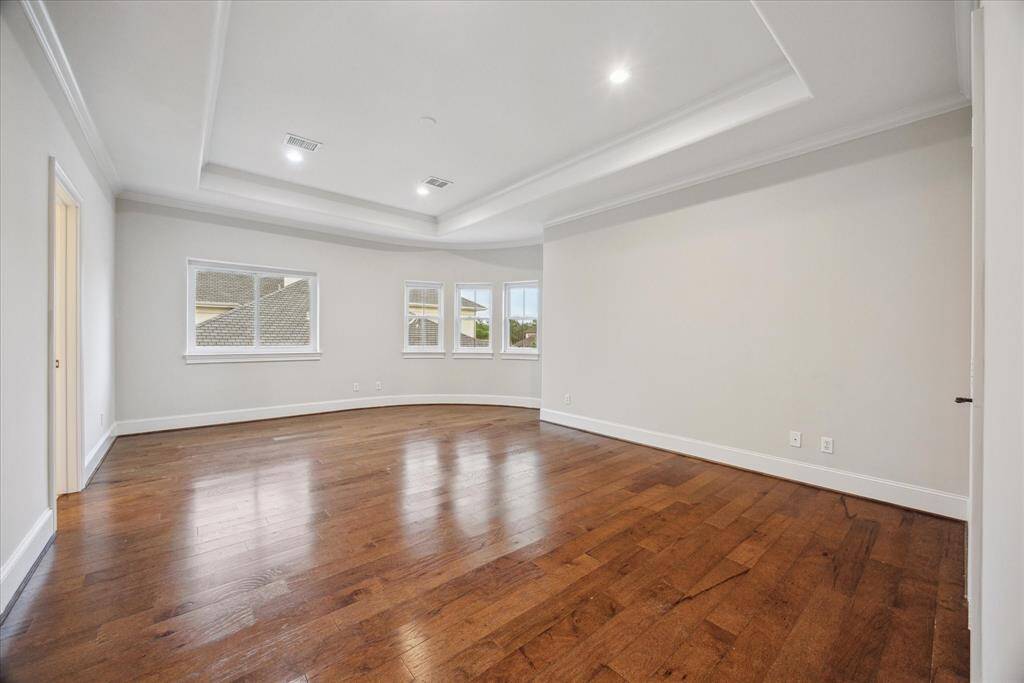 Each of the upstairs bedrooms features beautiful hard surface flooring and its own private ensuite bathroom with updated Taj Mahal countertops and modern hardware.