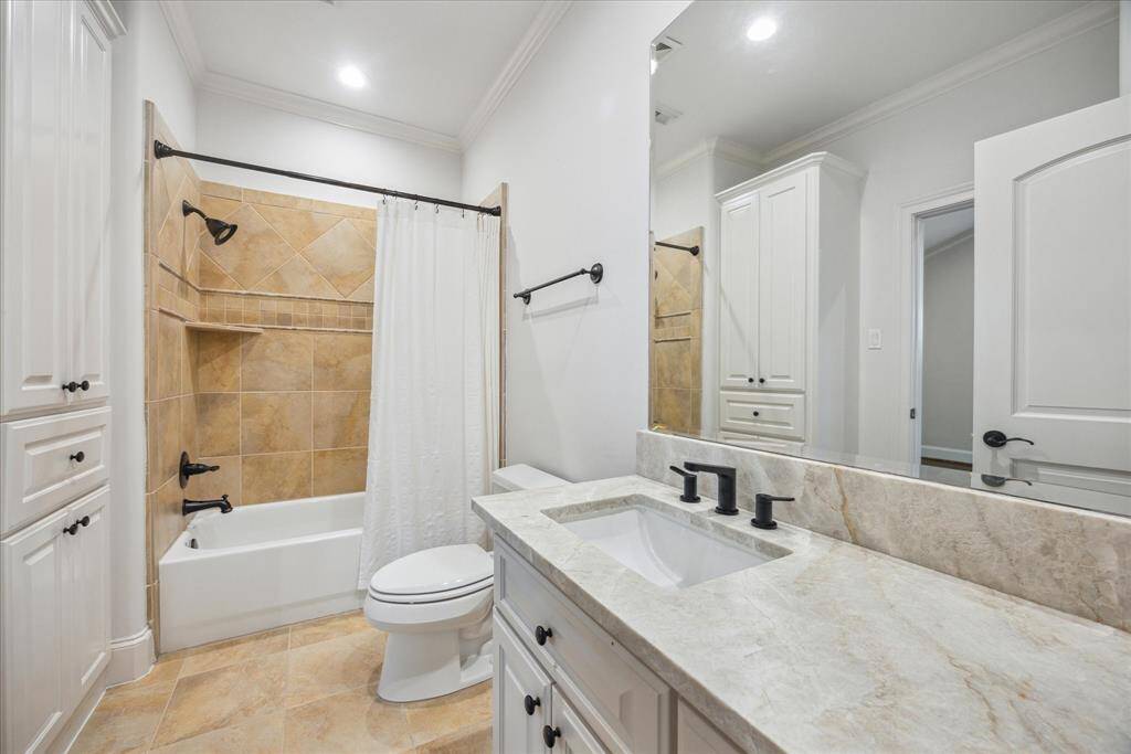 Ensuite bathroom with built-ins.